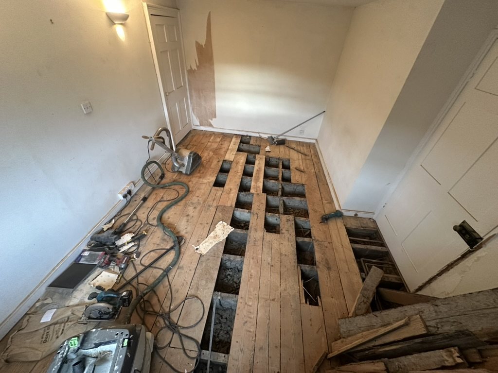 Original Georgian floorboards lifted for repair