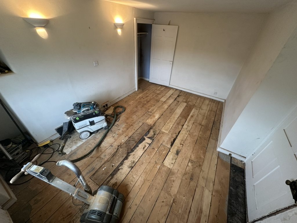 The repaired floor being sanded